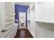 Organized walk-in closet with custom shelving and exterior door at 2528 Furnace Creek Ave, Henderson, NV 89074