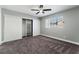 Bedroom featuring carpet, window, ceiling fan, and gray colored walls at 2549 Pine Creek Rd, Las Vegas, NV 89115