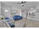 Spacious living area with hardwood floors, a ceiling fan, and easy access to the kitchen and dining area at 2900 Sunridge Heights Pkwy # 1916, Henderson, NV 89052