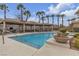 Community pool showcasing a covered seating area with barbecue and manicured landscaping at 2900 Sunridge Heights Pkwy # 1916, Henderson, NV 89052