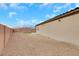 This low-maintenance backyard showcases desert landscaping, privacy fence, and partial turf at 3018 Carothers Ct, North Las Vegas, NV 89032