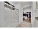 Bright bathroom with glass-enclosed shower and view of walk-in closet for optimal convenience at 3018 Carothers Ct, North Las Vegas, NV 89032