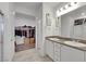 Bright bathroom with double vanity sinks, walk-in closet, and stand-up shower at 3018 Carothers Ct, North Las Vegas, NV 89032