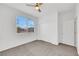 Bright bedroom featuring a window with views and a large closet for ample storage at 3018 Carothers Ct, North Las Vegas, NV 89032