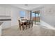 Light-filled dining area includes a table with seating for six and sliding glass doors at 3018 Carothers Ct, North Las Vegas, NV 89032