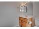 Bathroom with a wood vanity and framed mirrors at 3025 Treesdale Dr, Las Vegas, NV 89134