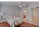 Bedroom showcasing a bed, carpet flooring, and an open doorway to an en-suite bathroom at 3025 Treesdale Dr, Las Vegas, NV 89134