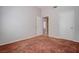 Bedroom with neutral walls and carpeted floors plus a view into an adjacent room at 3025 Treesdale Dr, Las Vegas, NV 89134