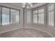 Cozy breakfast nook with bay window, plantation shutters, and tile flooring at 3025 Treesdale Dr, Las Vegas, NV 89134