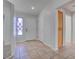 Entryway with tile flooring, a decorative window, and a white front door at 3025 Treesdale Dr, Las Vegas, NV 89134