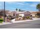 Charming single-story home with desert landscaping, palm trees, and a two-car garage at 3025 Treesdale Dr, Las Vegas, NV 89134