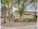 Exterior shot of the 'Arts and Crafts' building, framed by mature palm trees and trimmed landscaping at 3025 Treesdale Dr, Las Vegas, NV 89134