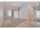 Inviting living room with neutral carpet and sliding glass door at 3025 Treesdale Dr, Las Vegas, NV 89134