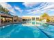 Outdoor pool surrounded by lounge chairs with a covered structure providing shaded seating areas at 3025 Treesdale Dr, Las Vegas, NV 89134
