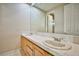 Bright bathroom featuring a double vanity with white tile countertops and modern fixtures at 3163 Elk Clover St, Las Vegas, NV 89135