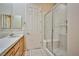 Bathroom showcasing vanity, mirror, and glass-enclosed walk-in shower with built-in seat at 3163 Elk Clover St, Las Vegas, NV 89135