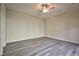 The home offers a spacious bedroom with neutral tones and contemporary light gray laminate flooring at 3163 Elk Clover St, Las Vegas, NV 89135