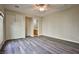 This bedroom features new floors, a ceiling fan, walk-in closet and en-suite bathroom at 3163 Elk Clover St, Las Vegas, NV 89135