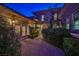 This home features a courtyard with brick pavers and evening lighting perfect for outdoor living at 3163 Elk Clover St, Las Vegas, NV 89135