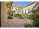 Private courtyard featuring brick paving, lush greenery, and access to the main house at 3163 Elk Clover St, Las Vegas, NV 89135