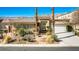 Charming single-story home featuring a beautiful desert landscape, tiled roof, and a welcoming entrance at 3163 Elk Clover St, Las Vegas, NV 89135