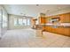 Open-concept kitchen with a central island, stainless steel appliances, and natural wood cabinets at 3163 Elk Clover St, Las Vegas, NV 89135