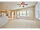 Bright and airy living room featuring tile floors, modern ceiling fan, and ample natural light at 3163 Elk Clover St, Las Vegas, NV 89135