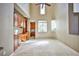 Spacious living room with tile flooring, custom built-ins, and high ceilings at 3163 Elk Clover St, Las Vegas, NV 89135