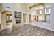 Cozy living room featuring a fireplace, hardwood floors, and an open floor plan at 3163 Elk Clover St, Las Vegas, NV 89135