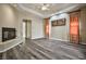 Living room showcases fireplace, wood floors, fan, and natural light at 3163 Elk Clover St, Las Vegas, NV 89135