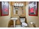 Well-lit powder room with a pedestal sink and decorative accents at 3163 Elk Clover St, Las Vegas, NV 89135