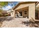 Covered back patio with sliding glass doors, ideal for outdoor gatherings and enjoying the backyard at 3167 Biccari Ave, Henderson, NV 89044