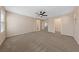Spacious bedroom featuring neutral walls, plush carpet, and a ceiling fan for added comfort at 3167 Biccari Ave, Henderson, NV 89044