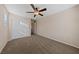 Bedroom with a double closet, plush carpet, and ceiling fan at 3167 Biccari Ave, Henderson, NV 89044