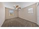 Neutral bedroom featuring plush carpet and two windows at 3167 Biccari Ave, Henderson, NV 89044