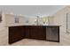 Kitchen island featuring granite countertops and stainless steel dishwasher at 3167 Biccari Ave, Henderson, NV 89044
