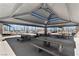 Covered picnic area with multiple tables, providing a comfortable outdoor gathering space at 3167 Biccari Ave, Henderson, NV 89044