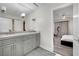 Bathroom features a double sink vanity, neutral paint, and tile flooring at 3221 Montecito Dr, Las Vegas, NV 89120