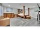 Spacious bedroom features wood-look floors and a stylish seating area at 3221 Montecito Dr, Las Vegas, NV 89120