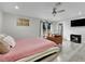 Modern bedroom has wood flooring, a platform bed, and ample natural light from the patio doors at 3221 Montecito Dr, Las Vegas, NV 89120