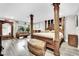 Opulent bedroom boasts wood-look floors, a sitting area, and abundant light at 3221 Montecito Dr, Las Vegas, NV 89120