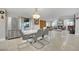 Open dining room featuring stainless steel appliances, large windows, and tile flooring at 3221 Montecito Dr, Las Vegas, NV 89120