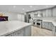 Beautiful modern kitchen with a stainless steel range, and gray custom cabinets at 3221 Montecito Dr, Las Vegas, NV 89120