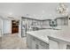 Bright kitchen with gray cabinets, stainless steel appliances, and a large island at 3221 Montecito Dr, Las Vegas, NV 89120