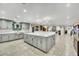 Kitchen featuring stainless steel appliances, large island, and pendant lighting at 3221 Montecito Dr, Las Vegas, NV 89120