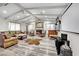 Spacious living room featuring a fireplace, hardwood floors, and high ceilings at 3221 Montecito Dr, Las Vegas, NV 89120