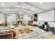 Bright living room featuring a fireplace, hardwood floors, and high ceilings at 3221 Montecito Dr, Las Vegas, NV 89120