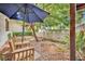 Cozy patio featuring wooden chairs and an umbrella at 3221 Montecito Dr, Las Vegas, NV 89120