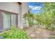 A cozy side yard with lush greenery and a charming stone path, adding a touch of nature to the home's exterior at 3221 Montecito Dr, Las Vegas, NV 89120