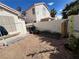 Spacious backyard with privacy walls and versatile space awaiting your personal touch for gardening and outdoor activities at 3673 Spring Day Ct, Las Vegas, NV 89147